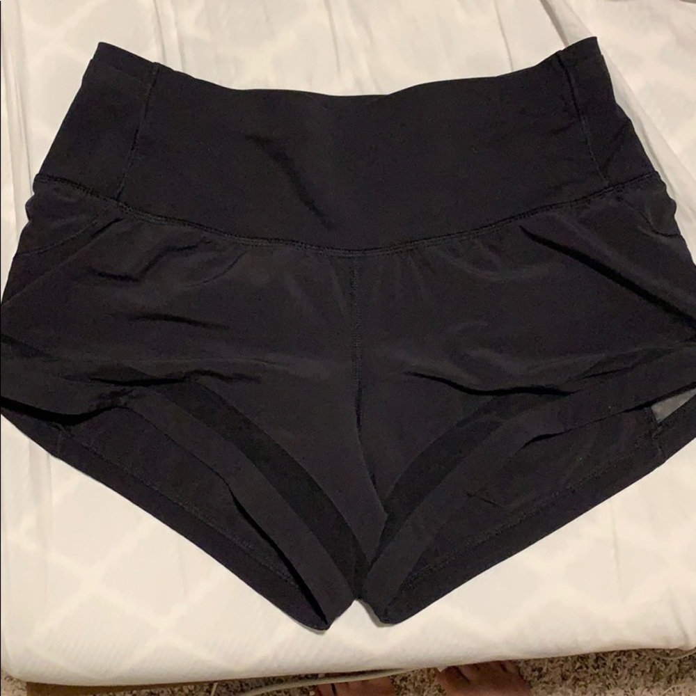 LULULEMON BLACK SHORTS w/ mesh design SZ 4